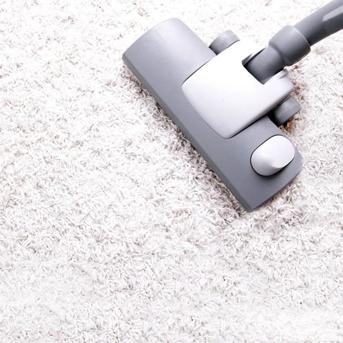 vacuum on carpeted floor
